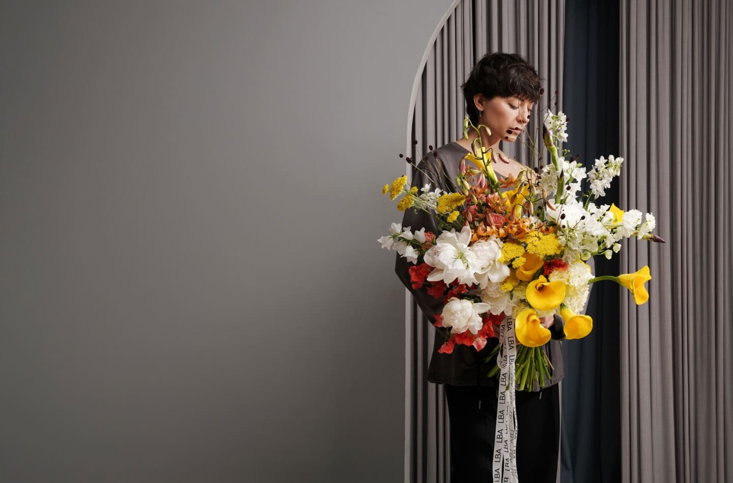 Lacy Bird florist with a signature bouquet